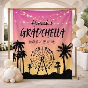 May include: A backdrop with a pink and orange gradient, featuring the text "Hannah's GRADCHELLA CONGRATS CLASS OF 2026". The design includes a Ferris wheel silhouette, palm trees, and string lights. Balloons in white and beige are in the foreground.