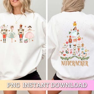 May include: White sweatshirt with a Nutcracker themed Christmas tree design on the back. The front of the sweatshirt features a Nutcracker, a mouse, and two ballerinas.