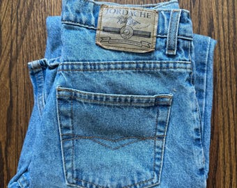 Jeans Jordache vintage de tiro alto y pierna recta de los años 90, mezclilla lavada clara, talla W27