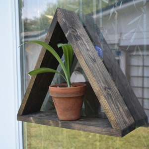 hanging shelf , suction cup shelf , plant hanger