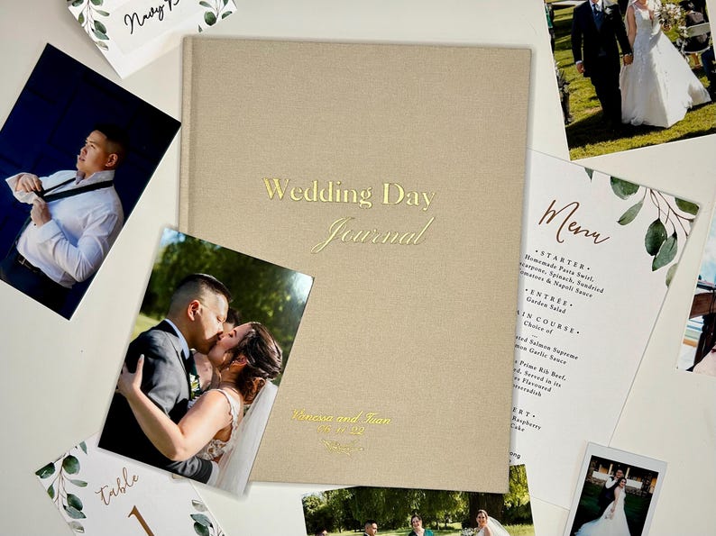 The Wedding Day journal surrounded by wedding pictures and other wedding paper memorabilia.