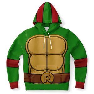 May include: Green hooded sweatshirt with a red stripe on the hood and sleeves. The front of the sweatshirt features a cartoon image of a turtle shell with a brown belt and a gold 'R' on the buckle.