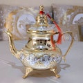 Hand-decorated Moroccan brass teapot - A treasure of craftsmanship, elegance, and tradition, a unique gift idea showcasing Moroccan artistry. product logo