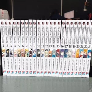 May include: A collection of 23 manga volumes of Pandora Hearts, a dark fantasy series by Jun Mochizuki. The spines are white with black text and illustrations of characters from the series.