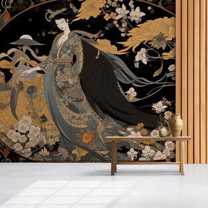 May include: A black and gold floral wallpaper mural featuring a woman in a traditional Japanese kimono with a black bird wing. The mural is displayed in a room with a wooden table and a vase.