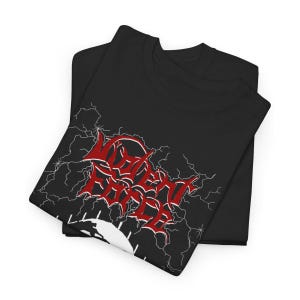 May include: Black t-shirts with a red and white graphic design. The design features the text "NO FEAR" in a stylized font, surrounded by white lightning bolts. The shirts are folded and stacked.