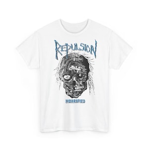 May include: White t-shirt with a black and white graphic of a skull with the text "Repulsion" and "Horrified" printed on it.