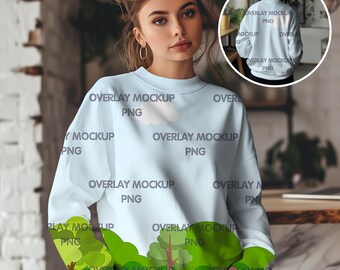May include: A light blue sweatshirt with a white cloud and green trees printed on it. The text "OVERLAY MOCKUP PNG" is repeated throughout the design.