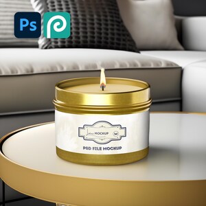 May include: A gold candle jar with a white label that says "Mockup PSD File Mockup". The candle is lit and the flame is visible.