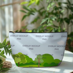 May include: A light blue zippered pouch with a white background and a repeating pattern of green trees and the text "Overlay Mockup PNG".