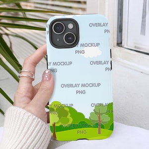May include: A blue and white phone case with a cartoon landscape design. The case has the text "Overlay Mockup PNG" repeated multiple times.