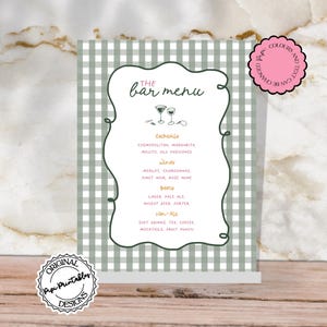 May include: A bar menu sign with a green and white checkered background. The menu lists cocktails, wines, beers, and non-alcoholic beverages. The text is in a handwritten style, with decorative swirls around the menu items.