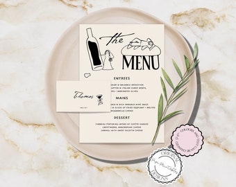 May include: A printable menu template featuring a hand-drawn illustration of a person relaxing on a loaf of bread. The menu includes the text "The Menu" and lists entrees, mains, and dessert options. The text "Thomas" is written on a separate card.