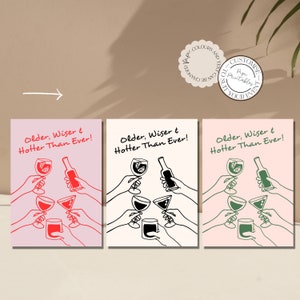 May include: Three printable cards with a pink background and black line drawings of people raising glasses of wine and a bottle. The text on the cards reads "Older, Wiser & Hotter Than Ever!"