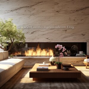 May include: A living room interior with a white couch, a wooden coffee table, a fireplace with a fire burning, a bookshelf, and a white armchair. There are plants and flowers in the room. The text "@VideoCallBackgrounds on Etsy" is visible in the image.