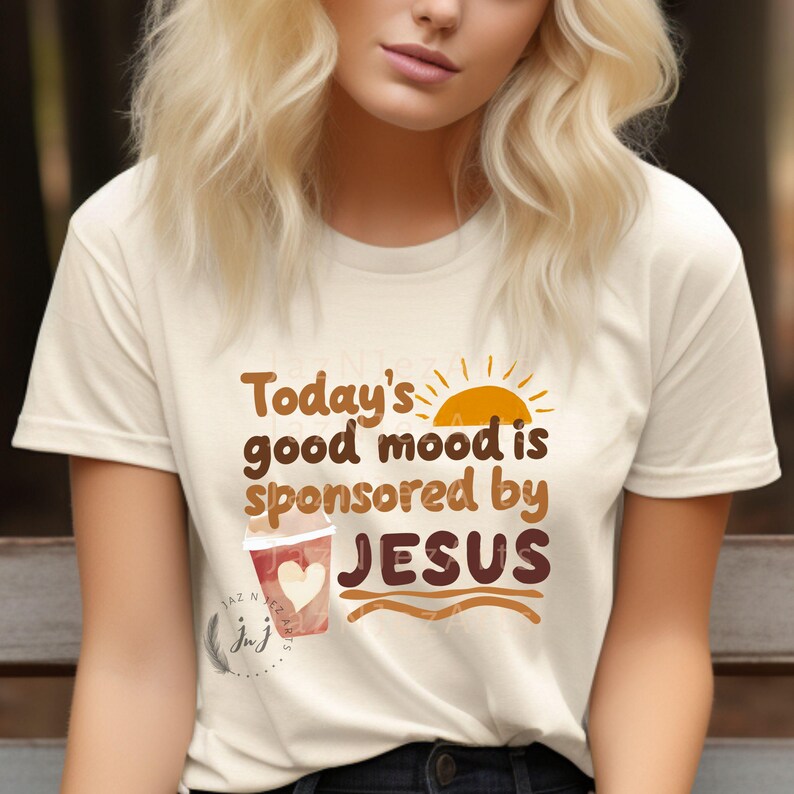 May include: A white t-shirt with the text "Today's good mood is sponsored by JESUS" in brown lettering. A stylized sun and a cup of coffee with a heart are also featured on the shirt.