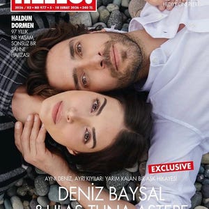 May include: The cover of "HELLO!" magazine features a couple lying down, with the woman's head resting on the man's shoulder. The magazine title is in large red letters. Text includes "EXCLUSIVE" and names "DENIZ BAYSAL & ULAS TUNA ASTEPE".