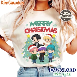 May include: Cream-colored t-shirt featuring a Christmas design with the text "MERRY CHRISTMAS" in green and red. The graphic includes cartoon figures, Christmas trees, and snowflakes. The shirt also has the text "DOWNLOAD PNG FILE".