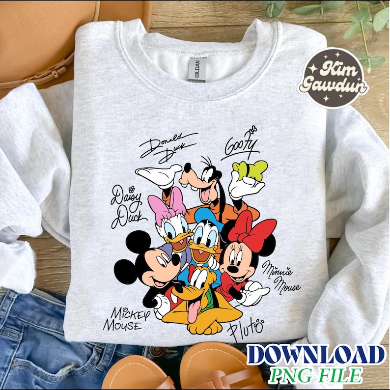 May include: Light gray Gildan sweatshirt featuring a colorful graphic of Disney characters including Mickey Mouse, Minnie Mouse, Donald Duck, Daisy Duck, Goofy, and Pluto. The characters' names are written above or below them in a script font.