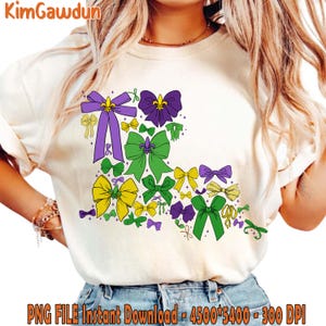 May include: Cream-colored t-shirt featuring a design of colorful bows in shades of purple, green, and yellow. The bows are arranged in a decorative pattern. The text "KimGawdun" is at the top left. The bottom of the shirt has the text "PNG FILE Instant Download - 4500*5400 - 300 DPI".