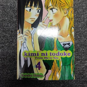 May include: Volume 4 of the manga series "kimi ni todoke: From Me to You" by Karuho Shiina. The cover features two young women, one with black hair and the other with blonde hair, looking at each other.