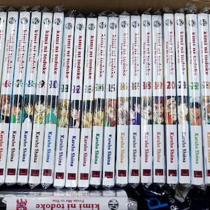 May include: A complete set of 29 manga volumes of "Kimi ni Todoke" by Karuho Shiina. The spines of the books are white with black text and feature a colorful illustration of the characters from the series.