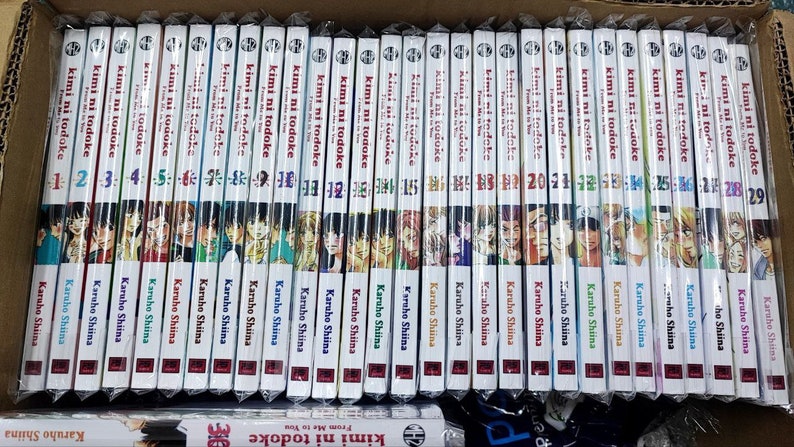May include: A complete set of 29 manga volumes of "Kimi ni Todoke" by Karuho Shiina. The spines of the books are white with black text and feature a colorful illustration of the characters from the series.