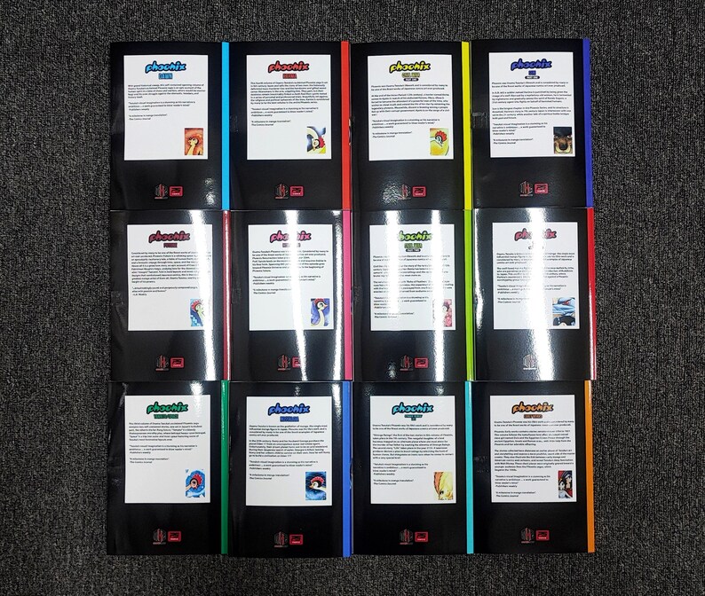 May include: A set of 10 Phoenix comic books, each with a different colored cover. The covers feature a black background with white text and a colorful illustration. The titles of the comics are "Phoenix #1", "Phoenix #2", "Phoenix #3", "Phoenix #4", "Phoenix #5", "Phoenix #6", "Phoenix #7", "Phoenix #8", "Phoenix #9", and "Phoenix #10".