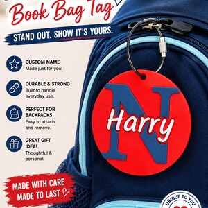 May include: A circular red bag tag with a large blue letter N and the name Harry in white script, attached to a navy blue backpack with a metal ring. The image includes text: PERSONALIZED Book Bag Tag, STAND OUT. SHOW IT'S YOURS, and more.
