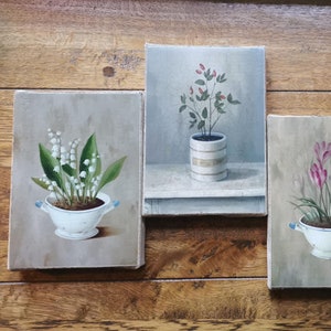 Set of four holographic paintings of flowers in a vase on wooden frames. Victorian holographic process replicates vintage oil paintings, 1995.