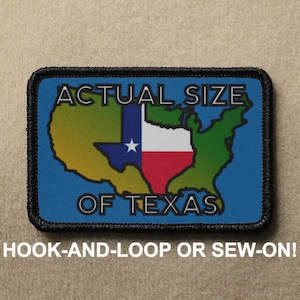 May include: A blue patch with black stitching and white text that reads "ACTUAL SIZE OF TEXAS". The patch features a stylized outline of the United States with the state of Texas highlighted in the colors of the Texas flag. The patch is designed to be attached with hook-and-loop or sewn on.