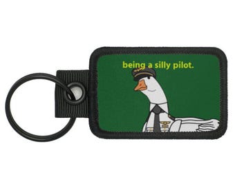 Piloot Captain Airplane Aircraft - Silly Goose Jobs-serie - Meme Funny Tactical Morale-sleutelhanger - Sleutelhangercollectie van LUMOLA STUDIO