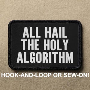 May include: Black patch with white text that reads "ALL HAIL THE HOLY ALGORITHM". The patch is for hook-and-loop or sew-on attachment.