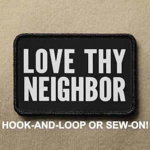May include: Black patch with white text that reads "LOVE THY NEIGHBOR". The patch is for hook-and-loop or sew-on attachment.