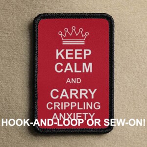 May include: Red embroidered patch with a white crown, the text "KEEP CALM AND CARRY CRIPPLING ANXIETY" and the words "HOOK-AND-LOOP OR SEW-ON!"