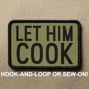 May include: A green and black patch with the text "LET HIM COOK" in black lettering. The patch is designed to be attached with hook-and-loop or sewn on.