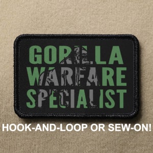 May include: Black patch with white stitching. The patch has green text that reads "GORILLA WARFARE SPECIALIST" in a stacked format.