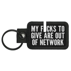 May include: Black key chain with a black and white patch that reads "My F*cks To Give Are Out Of Network".