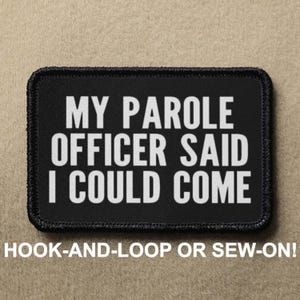 May include: Black and white patch with the text "MY PAROLE OFFICER SAID I COULD COME" in white lettering. The patch has a black border and is labeled "HOOK-AND-LOOP OR SEW-ON!"