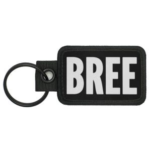 May include: Black key chain with a white patch that says "BREE" on it.