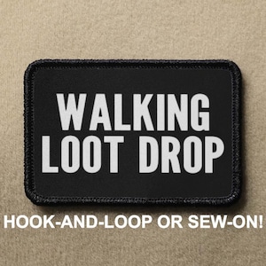 May include: A white ceramic mug with a black handle and the text "But First, Coffee" in a black, bold font. The mug is on a white surface. The mug is likely for hot beverages.