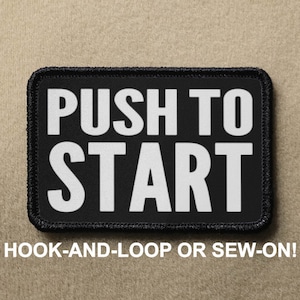 May include: Black patch with white text that reads "PUSH TO START". The patch is for hook-and-loop or sew-on attachment.