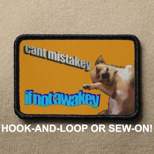 May include: A yellow and black embroidered patch with a dog and the text "cant mistakey if not awakey".