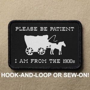 May include: Black and white patch with a white wagon pulled by a horse. The text reads "PLEASE BE PATIENT I AM FROM THE 1900s". The patch is for hook-and-loop or sew-on.