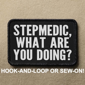 May include: A rectangular black patch with a stitched border featuring the white text "STEPMEDIC, WHAT ARE YOU DOING?" in a bold, sans-serif font. The patch is available with either a hook-and-loop backing or a sew-on finish for attachment.