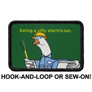 May include: A green patch with a white goose wearing a yellow hard hat and blue shirt. The goose is holding a wire and the text "being a silly electrician." is written in yellow letters. The patch is for hook-and-loop or sew-on.