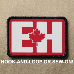 May include: Red and white patch with the letters "EH" and a Canadian maple leaf in the center. The patch has a black border and says "HOOK-AND-LOOP OR SEW-ON!" at the bottom.