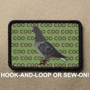 Puede incluir: Parche rectangular con borde negro que presenta una ilustración de paloma gris. El fondo es verde con texto marrón "COO" repetido. El parche incluye el texto "HOOK-AND-LOOP OR SEW-ON!"