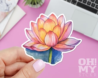 May include: A watercolor sticker of a lotus flower in shades of pink, orange, and yellow, with a blue-green base. The sticker has a white border and the text "OH MY STCKR" in the bottom right corner.
