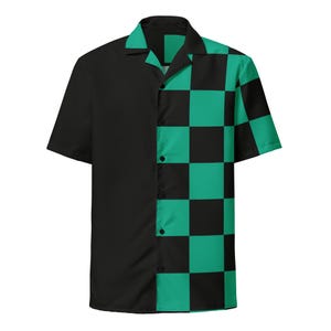 May include: Short-sleeved button-up shirt. The left side is solid black, while the right side features a green and black checkered pattern. The shirt has a classic collar and is buttoned down the front.